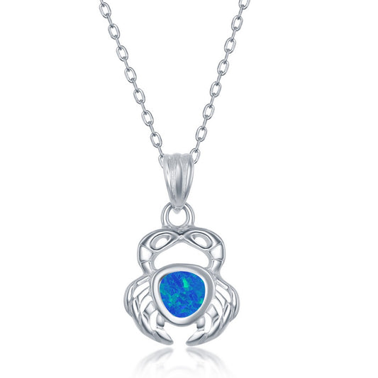 Sterling silver crab jewelry set featuring an opal inlaid crab pendant on a delicate chain