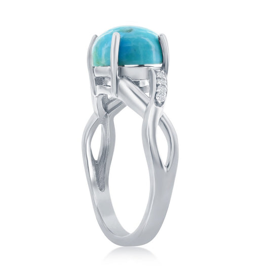 Elegant sterling silver turquoise ring featuring a polished turquoise stone and delicate accents