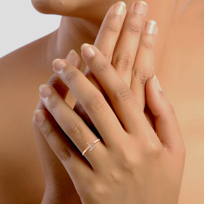Elegant 10K rose gold T initial ring on a model's hand, showcasing minimalist design and style