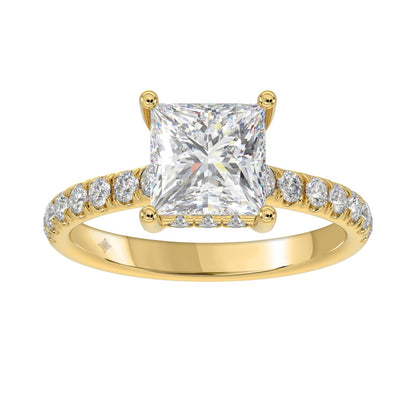 14K yellow gold princess diamond ring featuring a large center diamond and sparkling side stones