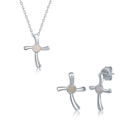 Elegant sterling silver cross jewelry set featuring a necklace and earrings with opal accents